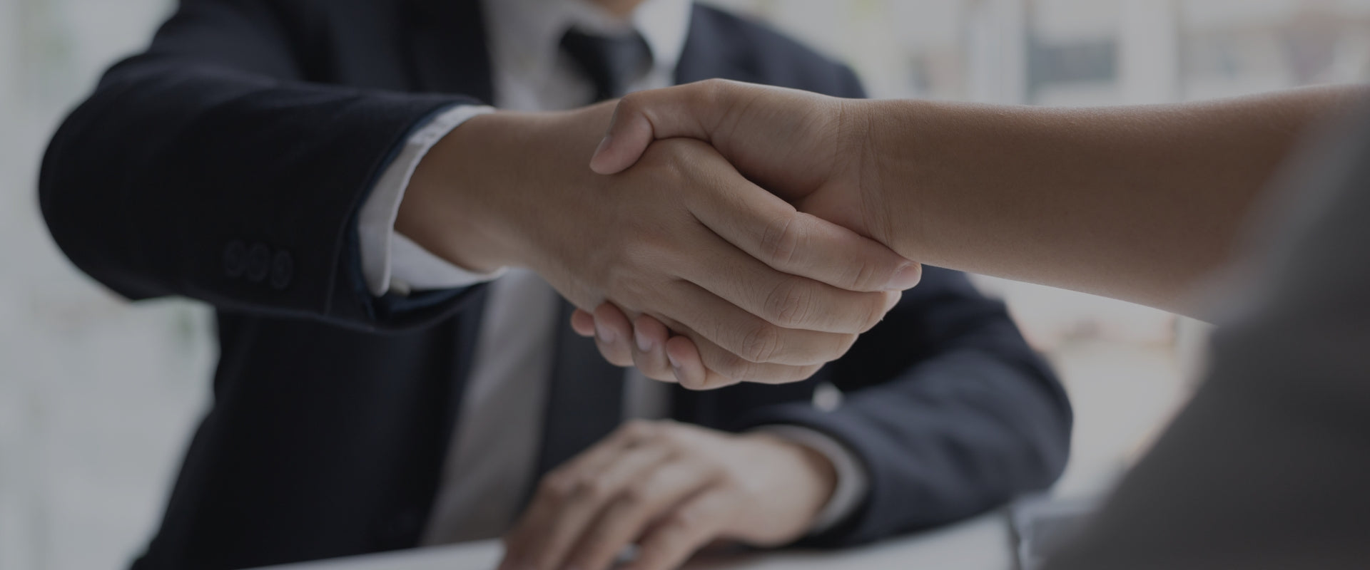 Business partnership handshake symbolizing trusted vendor and retailer collaboration