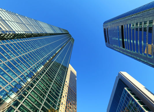 Modern commercial buildings symbolizing global business, procurement, and supplier networks at Continents Brands